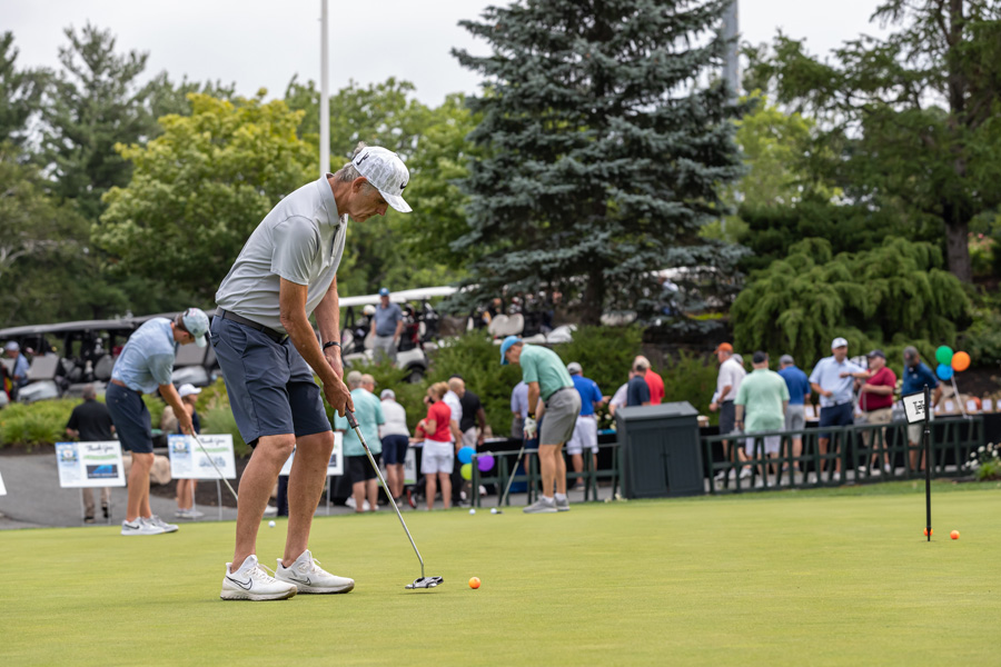 Golfers on putting green