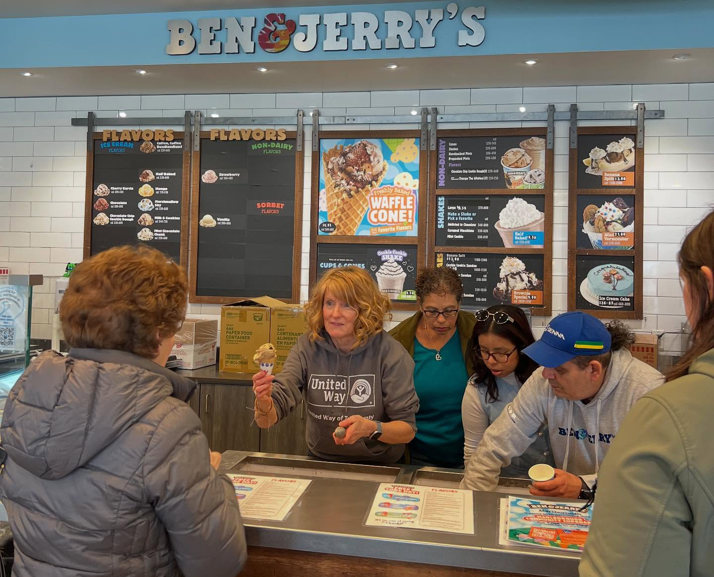 United Way nad MCC Staff and volunteers serve up cones at Ben & Jerry's Free Cone Day