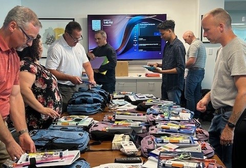 Web Industries Fills Backpacks