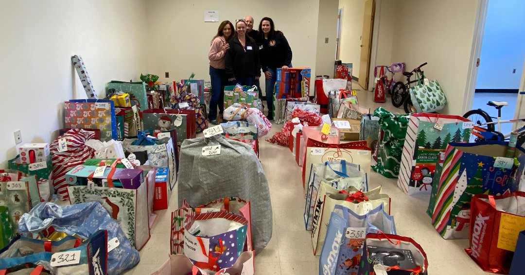 Volunteers sort gifts for Hope for the Holidays