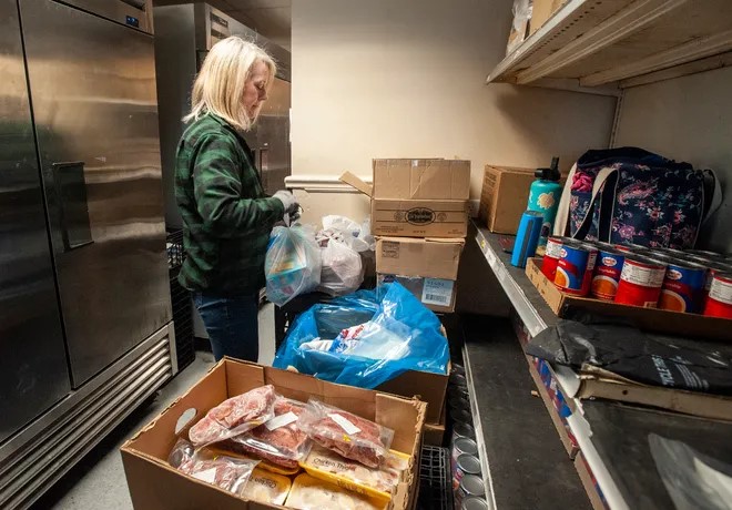 Suzy Fontano, a volunteer helps out at Pearl Street Cupboard