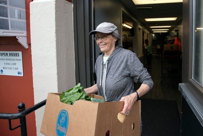 Volunteer brings fresh produce to pantry clients