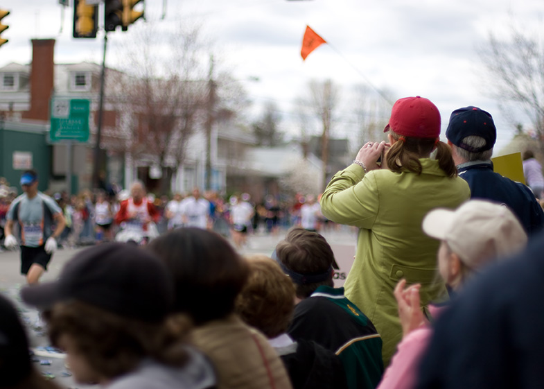 People watching marathon runners