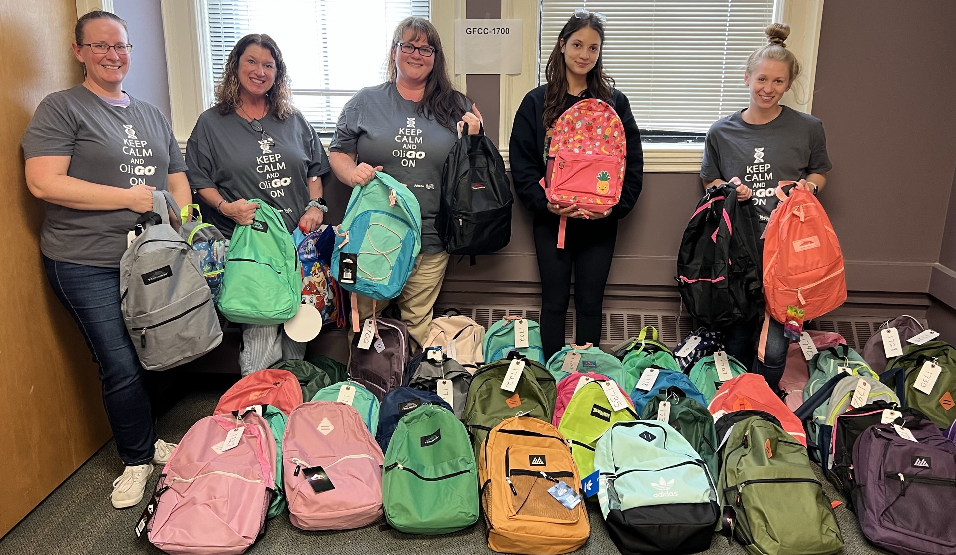 Volunteers filling backpacks