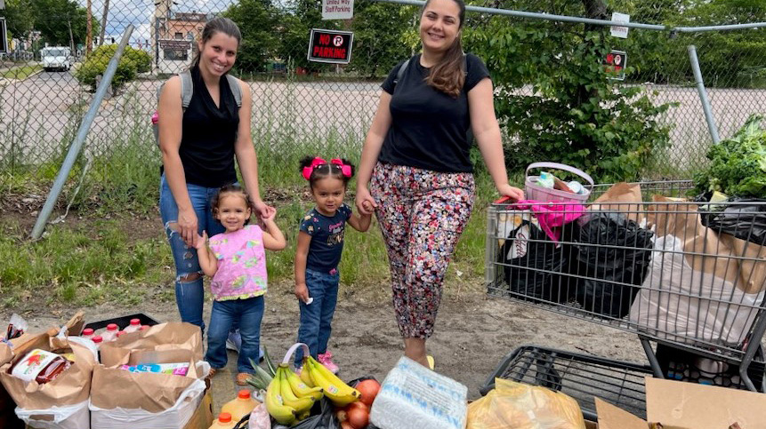 Clients receive food a the Pearl Street Cupboard