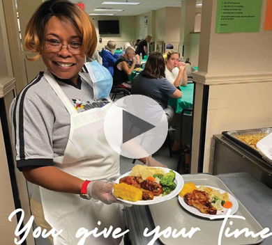 Volunteer Serving Meals
