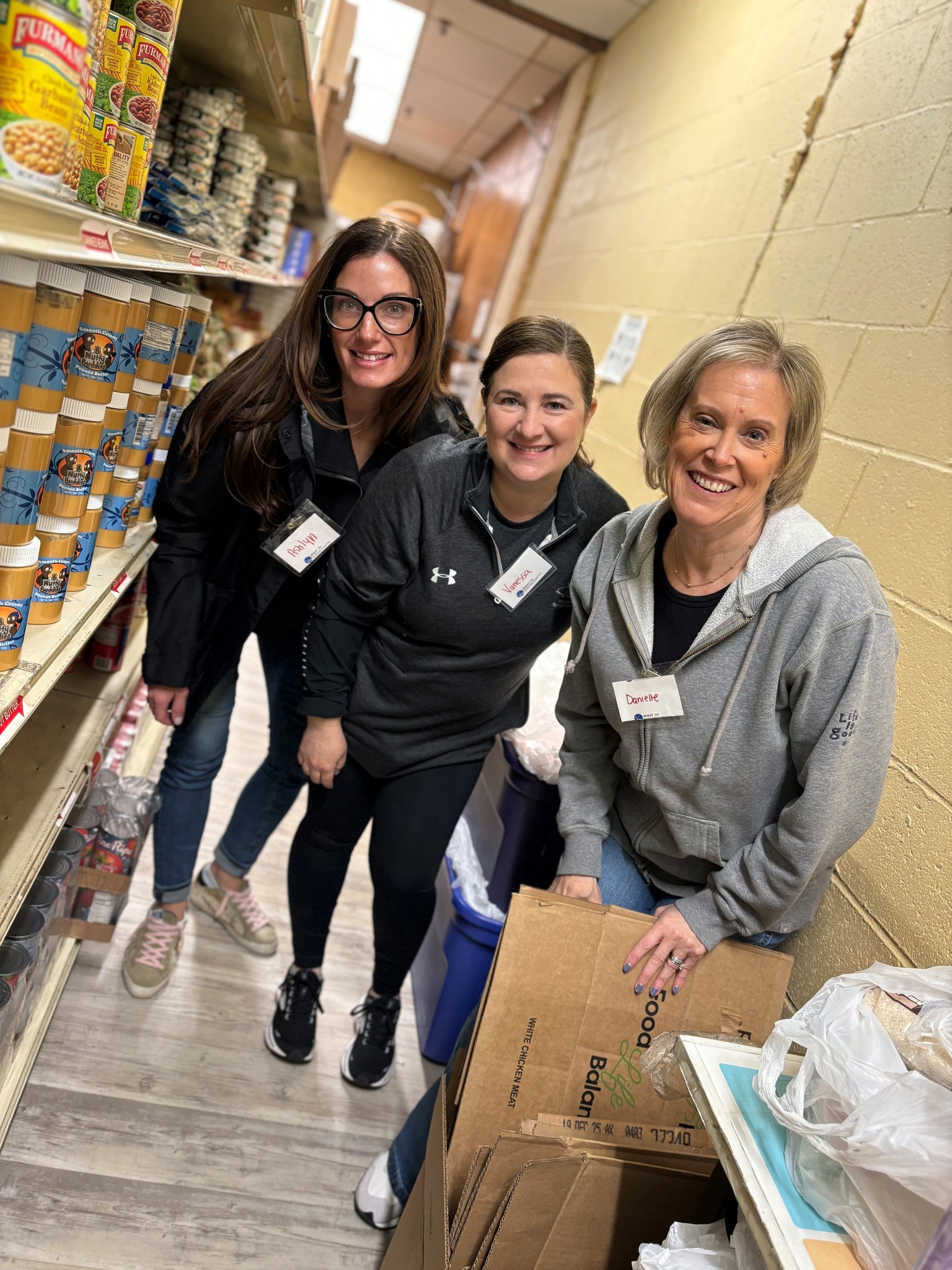 Volunteers Stock Shelves at WHEAT