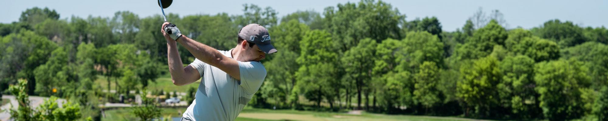Golfer Teeing off