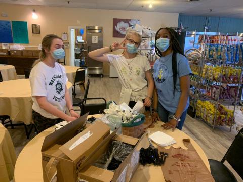 Three girls volunteer at WHEAT