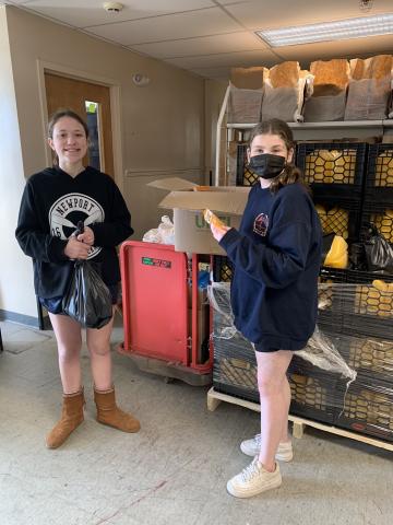 Two girls volunteer at Pearl Street